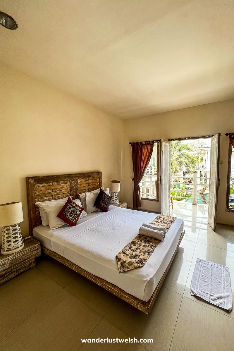 A modern hotel room in beige and cream colors