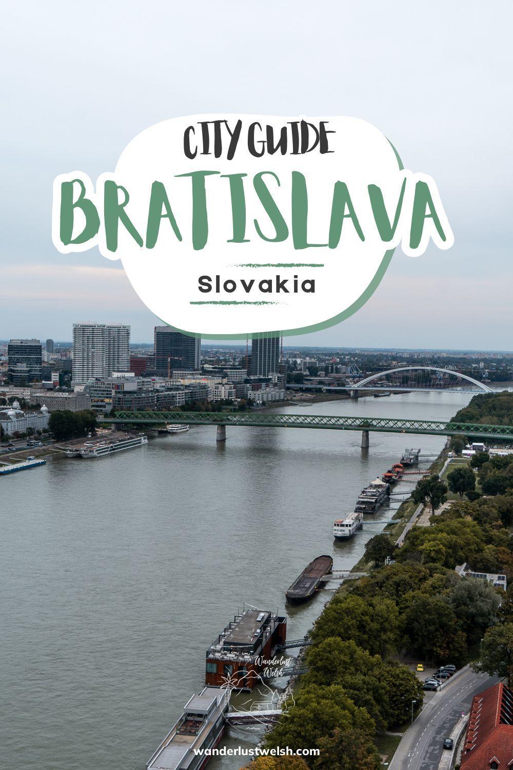 Aerial view of River Danube running through Bratislava with the words "City Guide to Bratislava" superimposed