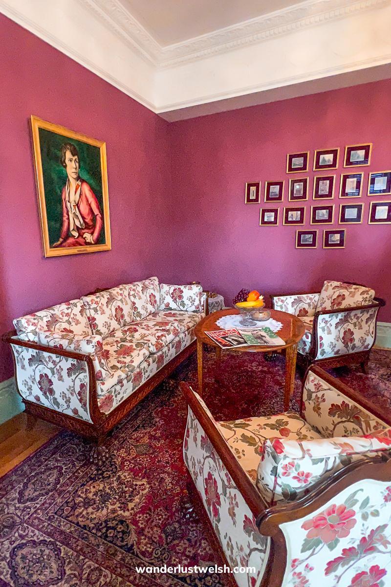 A pink room with floral furniture in a Villa