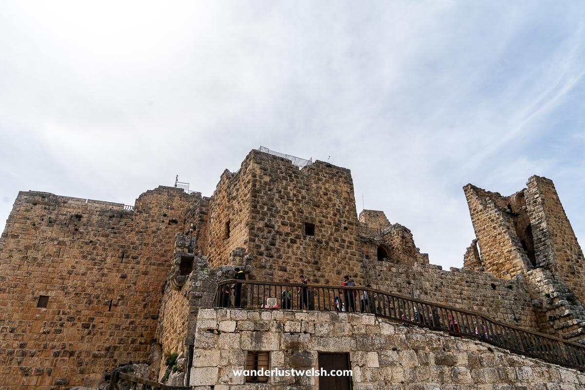 Ajloun Castle - A light brown colored stone castle with multiple towers and rooms