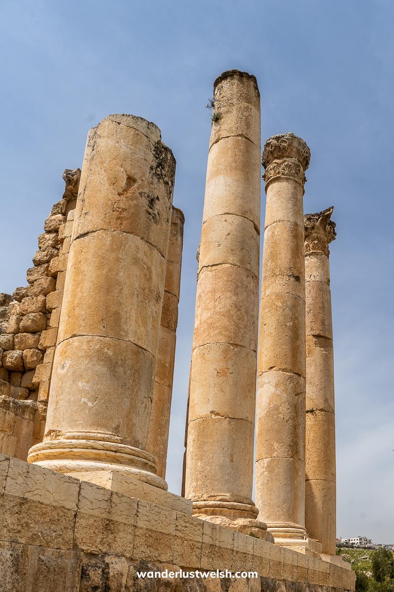 A set of ionic columns made from tan colored stone