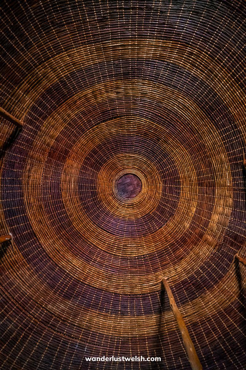 A circular wicker pattern making up the roof of a traditional Rwandan house