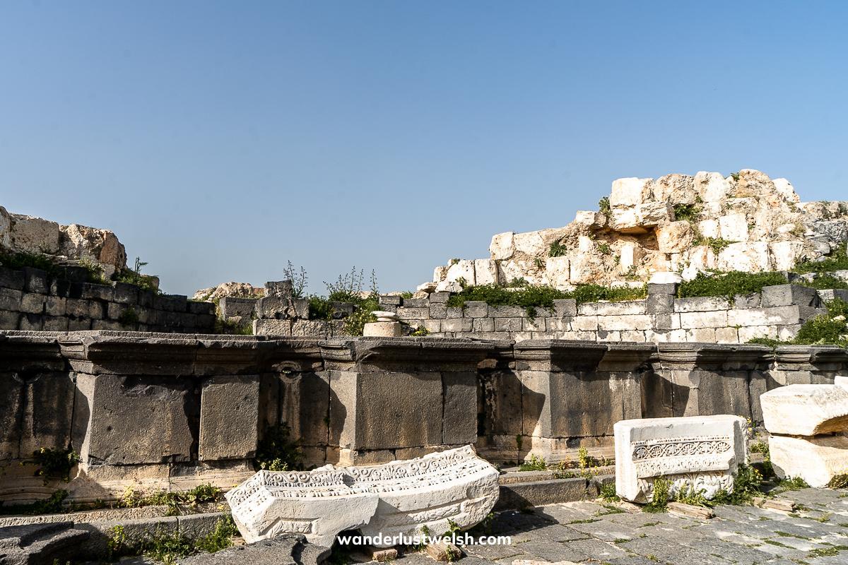 Ruined remains of a black and light stone nymphaeum