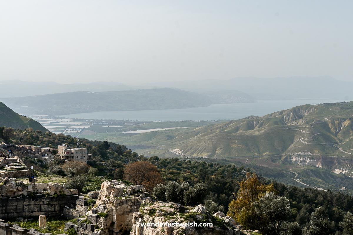 A panoramic view of the Sea of Galilee and surrounding hilly scrubland