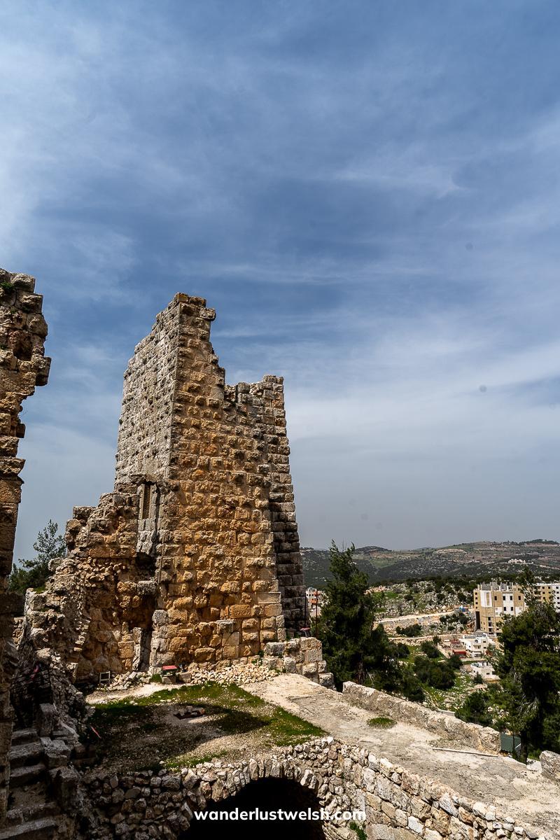 A partially ruined stone watchtower