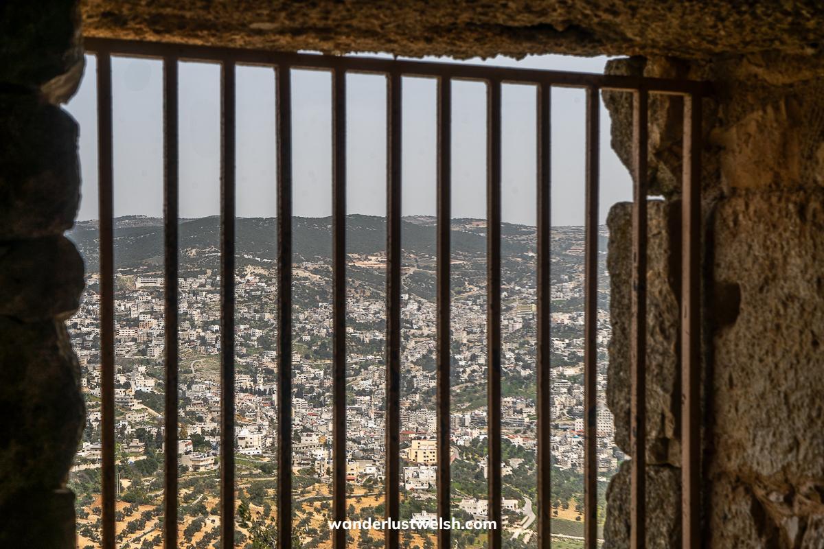 A north Jordan landscape from a window with bars