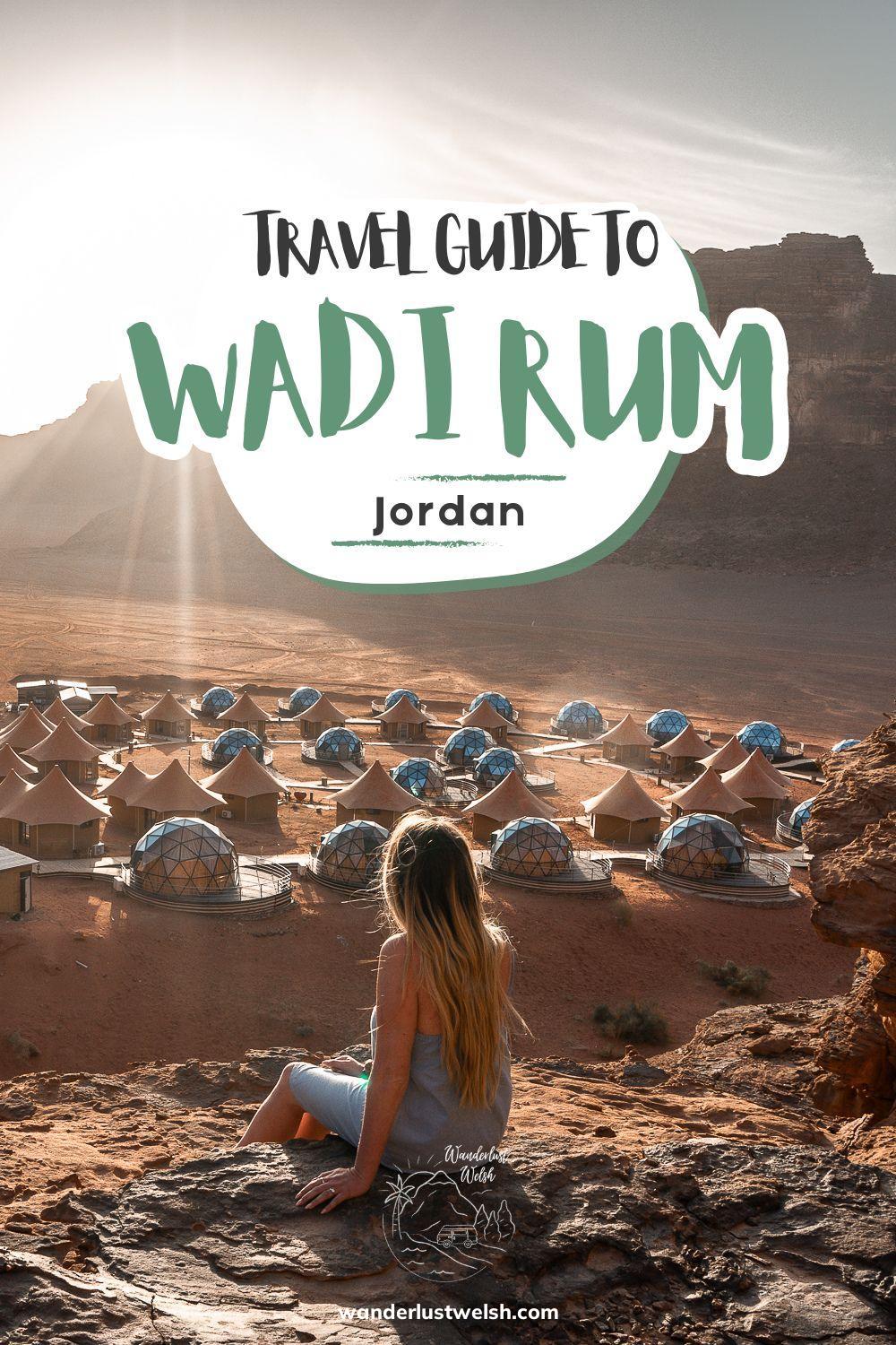 A woman looking out over a resort of glass domes in the desert with the words "Travel Guide to Wadi Rum" superimposed